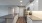 a kitchen with white cabinets