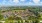 a city with many trees and buildings