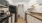a kitchen with white cabinets