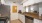 a kitchen with white cabinets