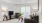 a living room with a tv and couches