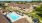 a swimming pool surrounded by houses