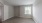 a room with a window and a carpet